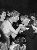 Aristotle Onassis kisses the hand of Madame André Bonnet, wife of the ex French ambassador. Gala evening at the Opera house., Monte Carlo 1958. - Photo by Edward Quinn