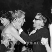 Aristotle Onassis and Madame André Bonnet, wife of the ex French ambassador, hug eachother. Gala evening at the Opera house., Monte Carlo 1958. - Photo by Edward Quinn