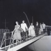 Guests leaving the yacht Christina of Aristotle Onassis for a gala night at Monte Carlo 1957. - Photo by Edward Quinn