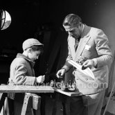 Aristotle Onassis with his son Alexander at Château de la Croë. He seems to be preparing his son's toy car. Cap d’Antibes 1954. - Photo by Edward Quinn
