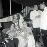 Tina Onassis and her sister Eugenie Niarchos, Cocktail on Onassis' yacht Christina. Monaco harbor 1957. - Photo by Edward Quinn