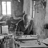 Pablo Picasso works on "Le picador" at the Madoura pottery. Vallauris 23.3.1953. - Photo by Edward Quinn