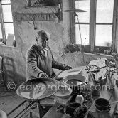 Pablo Picasso works on "La Pique" at the Madoura pottery. Vallauris 23.3.1953. - Photo by Edward Quinn