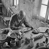 Pablo Picasso works on "La Pique" at the Madoura pottery. Vallauris 23.3.1953. - Photo by Edward Quinn