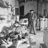Pablo Picasso at the sculpture studio Le Fournas where he accumulated all kinds of junk. Some of these pieces would inspire him, and out of the rubble a work of art would be born. Vallauris 1953. - Photo by Edward Quinn