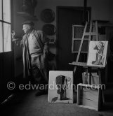 Pablo Picasso looking out from his painting studio to the village of Vallauris 1953. - Photo by Edward Quinn