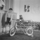 Claude Picasso and his bycycle. La Galloise, Vallauris 1953. - Photo by Edward Quinn