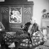 Picasso at La Galloise, In the background an automatic piano which Picasso bought 1950 in a bistro in Vallauris. La Galloise, 1953. - Photo by Edward Quinn