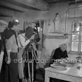 During filming of "Pablo Picasso", director Luciano Emmer and Pablo Picasso. With a statue of St-Claude Picasso, the patron saint of the potters, whose name was given to his younger son. Madoura pottery, Vallauris 14.10.1953. - Photo by Edward Quinn