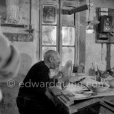 Picasso working on first version of plate of a woman (Irène Rignault, Madame X), during filming of "Picasso", directed by Luciano Emmer. Madoura pottery, Vallauris Oct 14 1953. - Photo by Edward Quinn