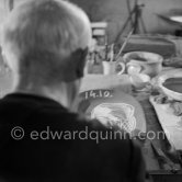 Pablo Picasso working on first version of plate of a woman (Irène Rignault, Madame X), during filming of "Pablo Picasso", directed by Luciano Emmer. Madoura pottery, Vallauris 14.10.1953. - Photo by Edward Quinn
