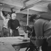 Pablo Picasso would sometimes squeeze a vase before the clay had hardened, molding it into a representational shape. "To give it life," he once said, "I have to wring its neck." Delighted that he could make the clay respond to any fantasy that passed through his mind, he shaped mythologicat figures such as fauns and satyrs, as well as vases representing graceful women, bulls, goats, fish, and above all, owls and doves. Here Pablo Picasso is working on small bird sculpture, Luciano Emmer film. Madoura pottery, Vallauris 14./15.10.1953. - Photo by Edward Quinn