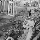 Pablo Picasso working in his sculpture studio Le Fournas making a sculpture figure with odds and ends from his scrap heap. The finished sculpture got the name "La femme à la clé (La Taulière)" ("Woman with a key"). Le Fournas, Vallauris 1953. - Photo by Edward Quinn