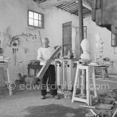 Pablo Picasso working in his sculpture studio Le Fournas making a sculpture figure with odds and ends from his scrap heap. The finished sculpture got the name "La femme à la clé (La Taulière)" ("Woman with a key"). Le Fournas, Vallauris 1953. - Photo by Edward Quinn
