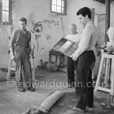 Pablo Picasso working in his sculpture studio Le Fournas making a sculpture figure with odds and ends from his scrap heap. The finished sculpture got the name "La femme à la clé (La Taulière)" ("Woman with a key"). Le Fournas, Vallauris 1953. - Photo by Edward Quinn