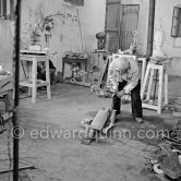 Pablo Picasso working in his sculpture studio Le Fournas making a sculpture figure with odds and ends from his scrap heap. The branch was later replaced by a key. The finished sculpture got the name "La femme à la clé (La Taulière)" ("Woman with a key"). Le Fournas, Vallauris 1953. - Photo by Edward Quinn