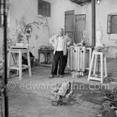 Pablo Picasso working in his sculpture studio Le Fournas making a sculpture figure with odds and ends from his scrap heap. The branch was later replaced by a key. The finished sculpture got the name "La femme à la clé (La Taulière)" ("Woman with a key"). Le Fournas, Vallauris 1953. - Photo by Edward Quinn