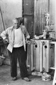 Picasso working in his sculpture studio Le Fournas making a sculpture figure with odds and ends from his scrap heap. The finished sculpture got the name "La femme à la clé (La Taulière)" ("Woman with a key"). Le Fournas, Vallauris 1953. - Photo by Edward Quinn