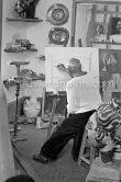 Pablo Picasso doing a charcoal drawing of the view from Le Fournas during filming of Luciano Emmer's documentary. Vallauris 26.6.1953. - Photo by Edward Quinn