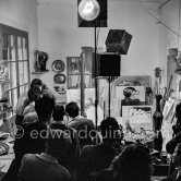 Pablo Picasso doing a charcoal drawing of the view from Le Fournas during filming of Luciano Emmer's documentary. Vallauris 26.6.1953. - Photo by Edward Quinn