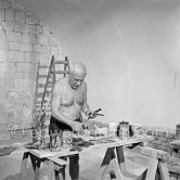 Pablo Picasso working on the "War and Peace study" drawings on the wall of Chapelle de la Paix (or Temple de la Paix) for the documentary film of Luciano Emmer. (The panels of War and Peace of 1952 were away on exhibition). Vallauris 1953. - Photo by Edward Quinn