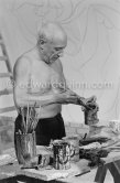 Pablo Picasso working on the "War and Peace study" drawings on the wall of Chapelle de la Paix (or Temple de la Paix) for the documentary film of Luciano Emmer. (The panels of War and Peace of 1952 were away on exhibition). Vallauris 1953. - Photo by Edward Quinn