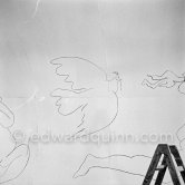 "War and Peace study" drawings on the wall of Chapelle de la Paix (or Temple de la Paix) for the documentary film of Luciano Emmer. (The panels of War and Peace of 1952 were away on exhibition). Vallauris 1953. - Photo by Edward Quinn