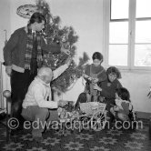 A rare document of Pablo Picasso with his four children, Paloma Picasso, Maya Picasso, Claude Picasso and Paulo Picasso. Christmas at La Galloise. The wagon was a gift from reporter Alfredo Quaglino and comes from Sicily. Vallauris 1953. - Photo by Edward Quinn