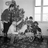 A rare document of Pablo Picasso with his four children, Paloma Picasso, Maya Picasso, Claude Picasso and Paulo Picasso. Christmastime at La Galloise. The wagon was a gift and comes from Sicily. Vallauris 1953. - Photo by Edward Quinn