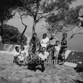 In the garden of house Shady Rock of Marie Cuttoli, close friend and collector of Pablo Picasso's works. From left: Javier Vilató, Paloma Picasso, Germaine Lascaux, wife of Vilató, Françoise Gilot, Paulo Picasso, Marie Cuttoli, Pablo Picasso, Maya Picasso, Claude Picasso. Cap d’Antibes 1954. - Photo by Edward Quinn