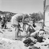 Pablo Picasso at the beach wih unknown person. Golfe-Juan 1954. - Photo by Edward Quinn