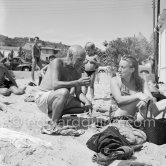 Pablo Picasso at the beach wih unknown person. Golfe-Juan 1954. - Photo by Edward Quinn
