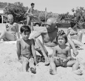 Pablo Picasso with his children Paloma Picasso and Claude Picasso at the beach of Golfe-Juan 1954. - Photo by Edward Quinn
