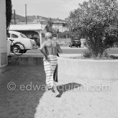 Pablo Picasso changing cloths. Golfe-Juan 1954. - Photo by Edward Quinn