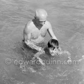 Paulo, Maya, Claude, Paloma. at beach, in the water, Picasso swimming. Golfe-Juan 1954. - Photo by Edward Quinn