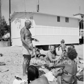Pablo Picasso at the beach wih unknown person. Golfe-Juan 1954. - Photo by Edward Quinn