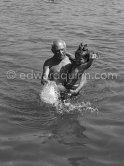 Picasso with his daughter Paloma at the beach. Golfe-Juan 1954. - Photo by Edward Quinn