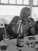Pablo Picasso at lunch at restaurant Nounou. Golfe-Juan 1954. - Photo by Edward Quinn