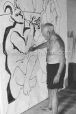 Pablo Picasso working on a bucolic pastoral scene on drawing paper which was to serve as background for the film "Le mystère Picasso". Nice, Studios de la Victorine 1955. - Photo by Edward Quinn
