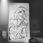 Pablo Picasso working on a bucolic pastoral scene on drawing paper which was to serve as background for the film "Le mystère Picasso". Nice, Studios de la Victorine 1955. - Photo by Edward Quinn