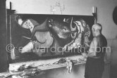 Pablo Picasso portrays a stage in the bullfight when the bullfighter is caught by the horns of the bull. During filming of "Le mystère Picasso". Nice, Studios de la Victorine, 1955. - Photo by Edward Quinn