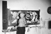 Pablo Picasso portrays a stage in the bullfight when the bullfighter is caught by the horns of the bull. During filming of "Le mystère Picasso". Nice, Studios de la Victorine, 1955. - Photo by Edward Quinn