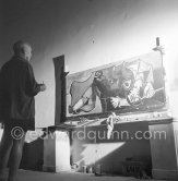 Pablo Picasso portrays a stage in the bullfight when the bullfighter is caught by the horns of the bull. During filming of "Le mystère Picasso". Nice, Studios de la Victorine, 1955. - Photo by Edward Quinn