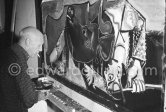 Pablo Picasso portrays a stage in the bullfight when the bullfighter is caught by the horns of the bull. During filming of "Le mystère Picasso". Nice, Studios de la Victorine, 1955. - Photo by Edward Quinn