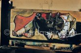 Pablo Picasso portrays a stage in the bullfight when the bullfighter is caught by the horns of the bull. During filming of "Le mystère Picasso". Nice, Studios de la Victorine, 1955. - Photo by Edward Quinn