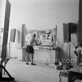 Pablo Picasso painting "La plage à la Garoupe I" for the film "Le mystère Picasso". Nice, Studios de la Victorine, 1955. - Photo by Edward Quinn