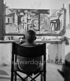 Pablo Picasso viewing his painting "La plage à la Garoupe I" for the film "Le mystère Picasso". Nice, Studios de la Victorine, 1955. - Photo by Edward Quinn