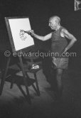Pablo Picasso at work during filming of "Le mystère Picasso". Nice, Studios de la Victorine, 1955. - Photo by Edward Quinn