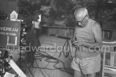 Pablo Picasso preparing to do his signature backwards. "Le mystère Picasso", Nice, Studios de la Victorine 1955. - Photo by Edward Quinn