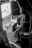 Pablo Picasso working on "La Célestine" where he had to do his signature backwards. "Le mystère Picasso", Nice, Studios de la Victorine 1955. - Photo by Edward Quinn